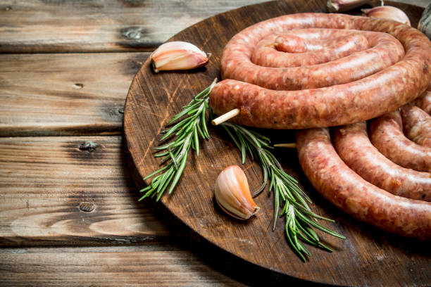 istock Raw sausage with rosemary and garlic. 1141525254