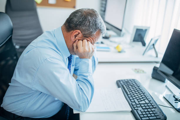 istock Senior businessman reading paperwork 1141526676