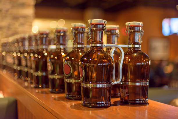 istock Beer growlers lined up on the bar 1141526810