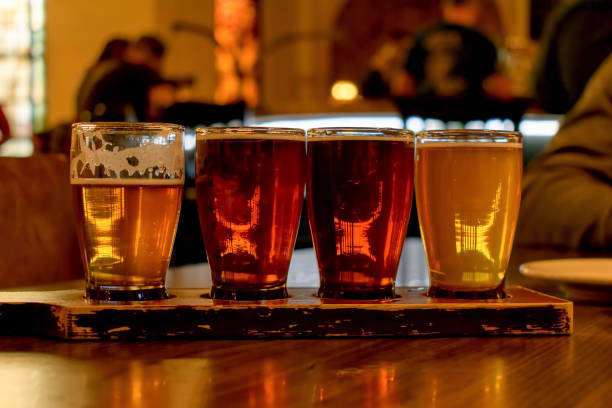 istock Tasting a variety of beer samples from a flight 1141527643