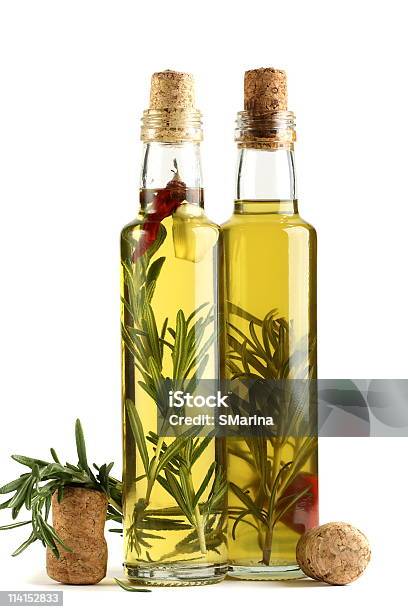 Olive Oil With Rosemary Garlic And Pepper Stock Photo - Download Image Now - Bottle, Color Image, Cooking