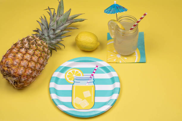 Summer party background with tropical drink and fresh pineapple Tropical party place setting for summer picnics and outdoor gatherings mason jar lemonade stock pictures, royalty-free photos & images