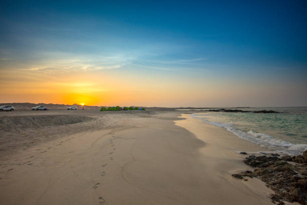 istock View of sunrise above beach, Oman 1141529344