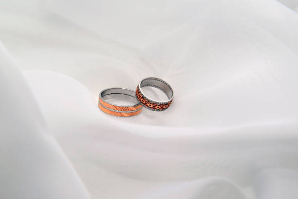 istock Engagement rings on a soft white background fabric. 1141529898