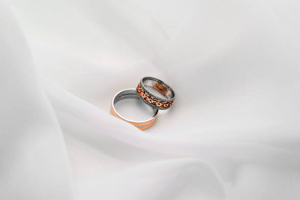 istock Engagement rings on a soft white background fabric. 1141530411