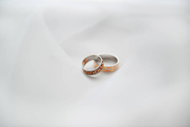 istock Engagement rings on a soft white background fabric. 1141530433