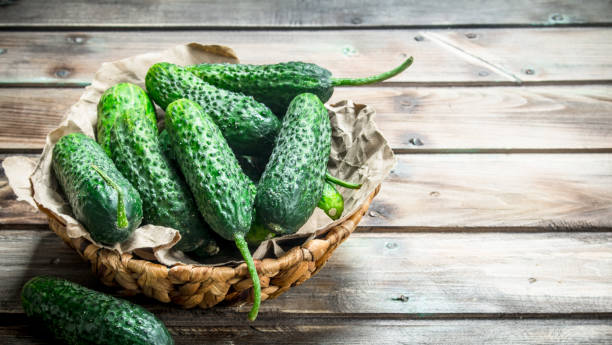 istock Green cucumbers in the basket. 1141531301