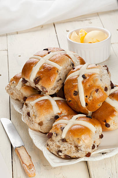 istock Stack of fresh hot cross buns with ramekin of butter 114153233