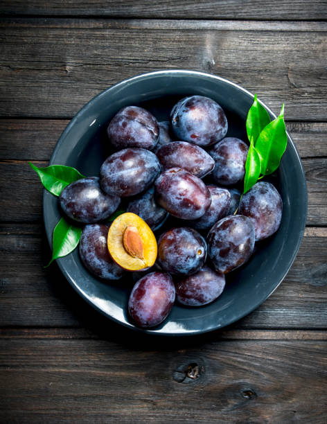 istock Fresh ripe plum on a plate. 1141532515