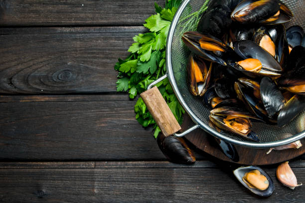 istock Fresh seafood clams with green parsley. 1141532565