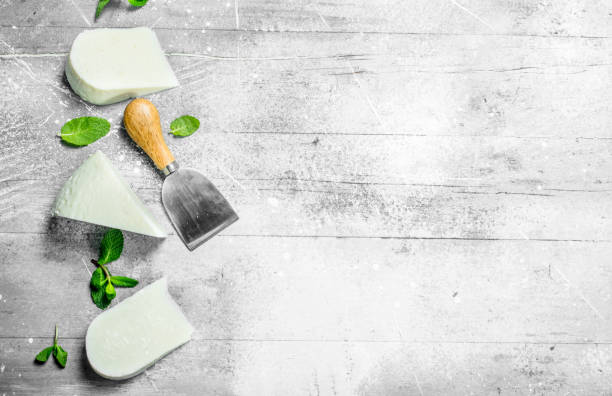 istock Soft sheep cheese with fresh mint leaves. 1141532567
