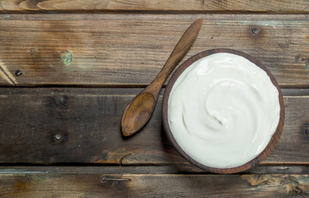 istock Fresh sour cream in bowl with spoon . 1141534513