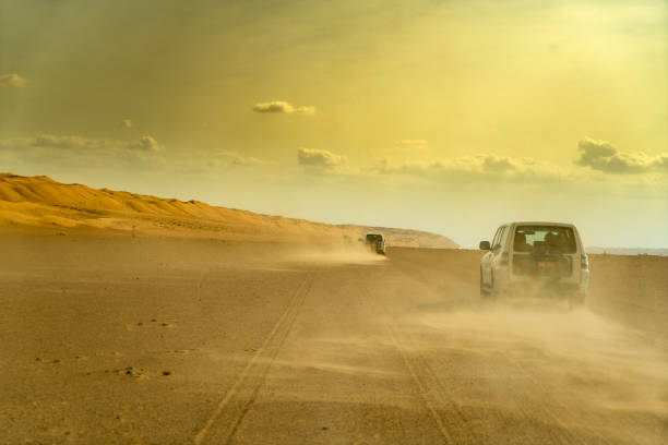 istock View of car on desert, Oman 1141536363