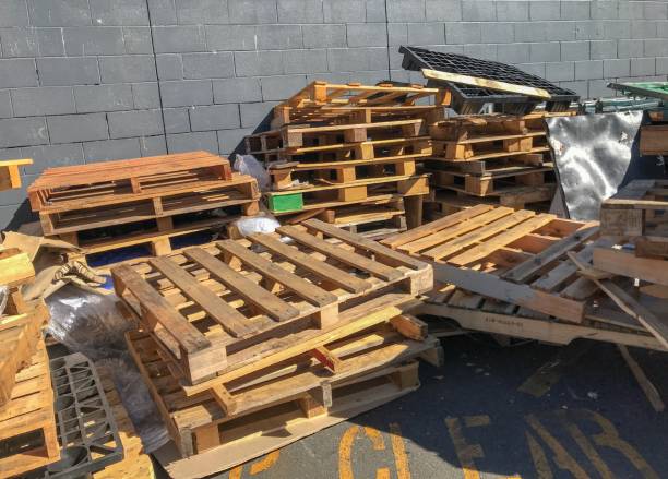 istock wooden pallets against a grey brick wall 1141536827