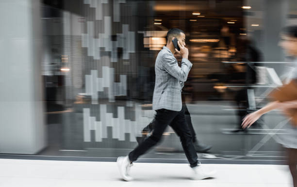 istock Businessman walking across the lobby 1141537988