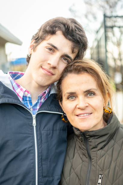 istock Smiling mature woman posing with her young son 1141538220