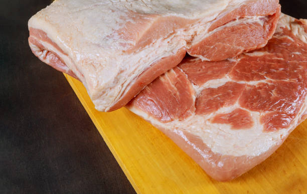 istock Raw pork leg on wooden cutting board ready for cooking 1141540570