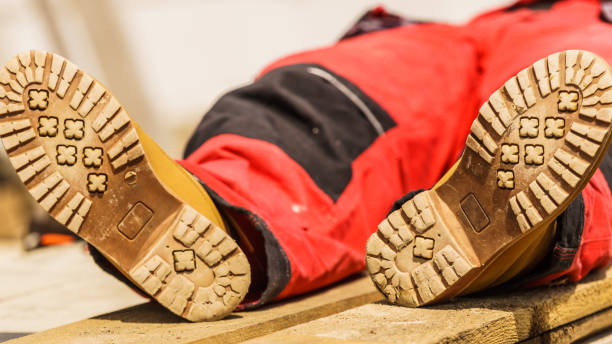 istock Person wearing red worker trousers 1141541824