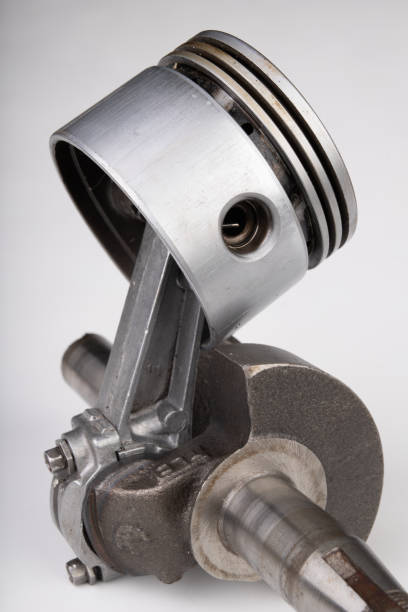 istock Piston and connecting rod of a small combustion engine. Components needed for mounting a high-power generator. light background. 1141541865
