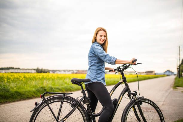 istock Woman with the electric bicycle 1141543505