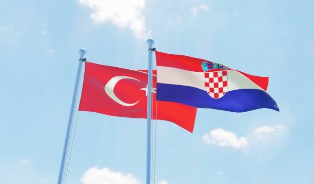 istock Croatia and Turkey, two flags waving against blue sky 1141544645