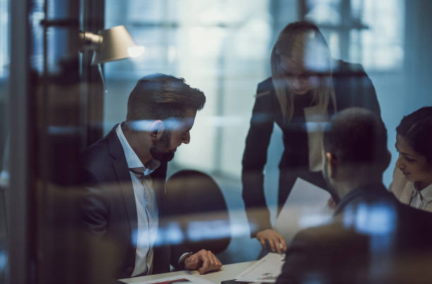 istock Business People Working Late in The Office 1141544670