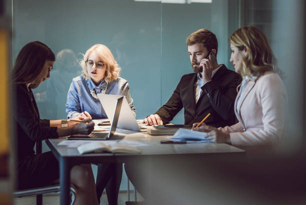 istock Business People Working Late in The Office 1141544896