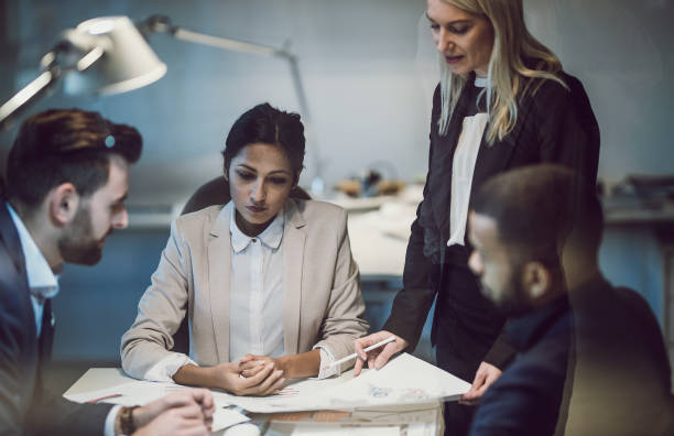 istock Business People Working Late in The Office 1141544986