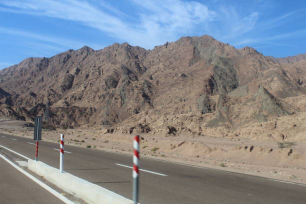 istock Asphalt road in the Egyptian desert. 1141547375