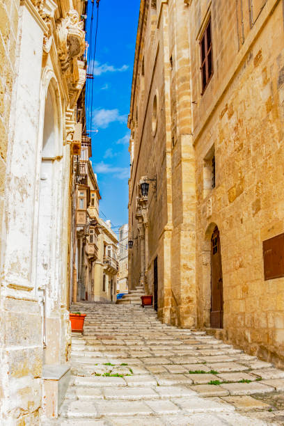 istock Typical beautiful Maltese limestone narrow lane 1141548144