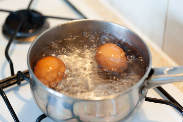 istock Boiling eggs in stainless steel pot - close-up 1141549814