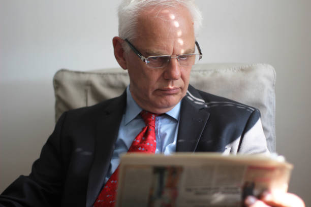 istock Business man relaxing with newspaper 1141553121
