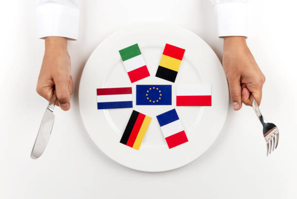 USA flag and EU flag print screen on two  fists  for battle.It is symbol of United States of America increase tariff tax barrier for import product from EU countries.-Image.