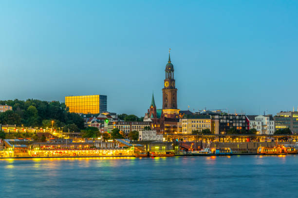 istock Elbe riverside in Hamburg with saint michaelis church, Germany. 1141559849
