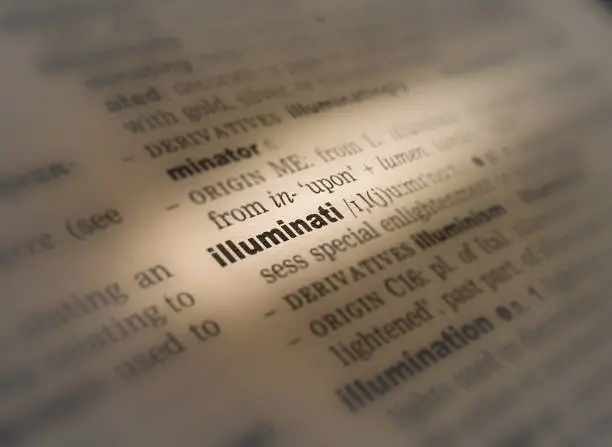 A close up of the definition of the word: Illuminati in an English dictionary.