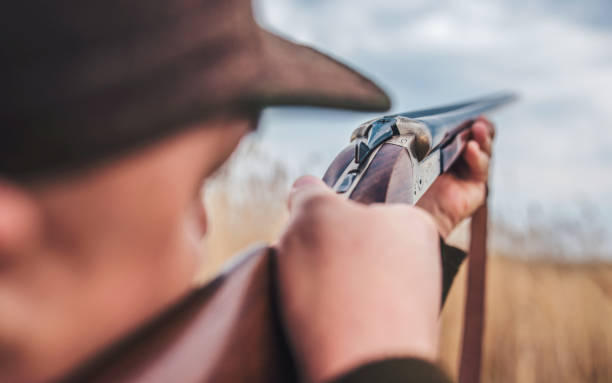 istock Hunter with a rifle in hunting 1141559987