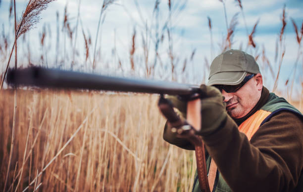 istock Hunter with a rifle in hunting 1141559988