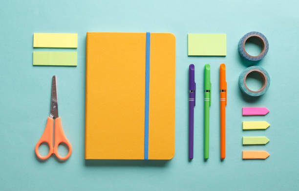 Office Table with Colorful Supplies Office desk working space flat lay with colorful supplies homework paper stock pictures, royalty-free photos & images