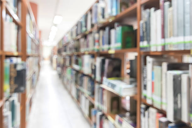 istock Blur school library or study room with book shelves for education background 1141566454
