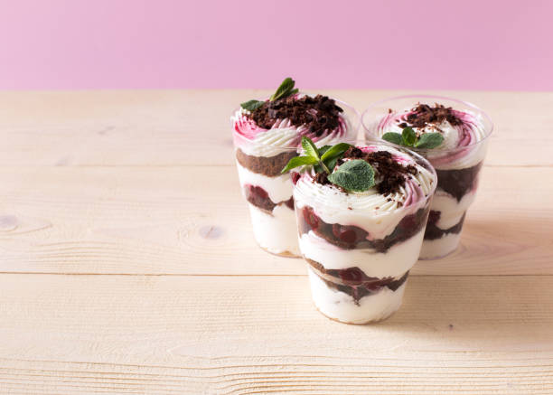 istock Homemade cake dessert. Trifle on pink background 1141567405