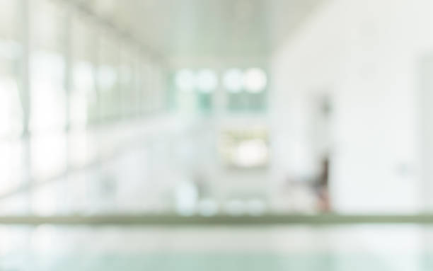 istock Office building blur background business lobby reception hall interior or empty indoor foyer meeting room with blurry light from glass wall window 1141568710
