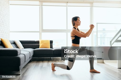 istock Adult Woman Training Legs Doing Inverted Lunges Exercise 1141568835