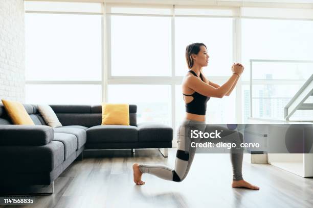 Adult Woman Training Legs Doing Inverted Lunges Exercise Stock Photo - Download Image Now