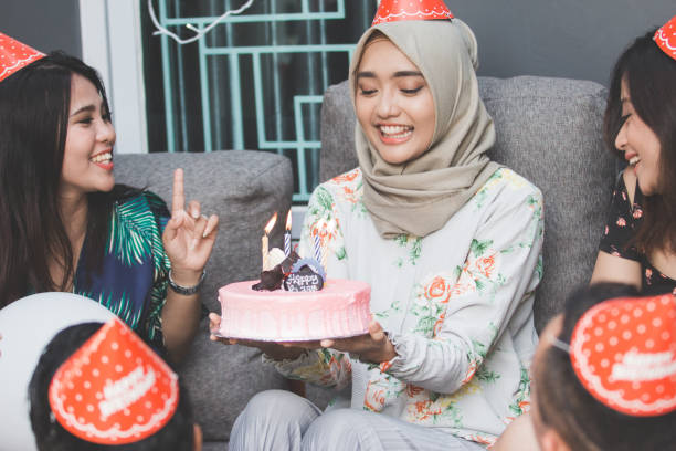 istock friends enjoying brithday party and singing together 1141570160