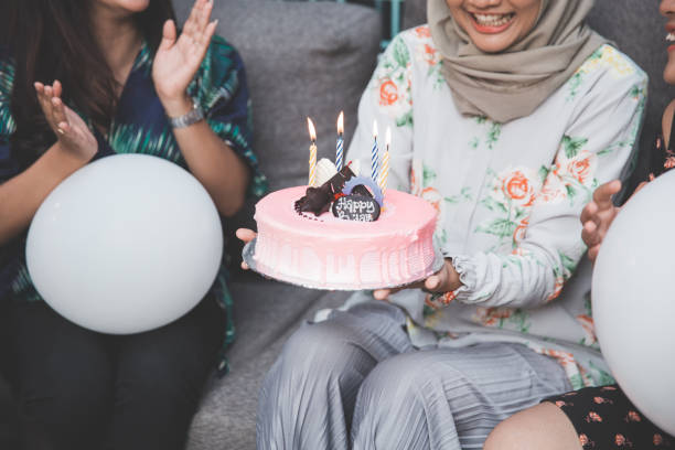 istock friends enjoying brithday party and singing together 1141570218