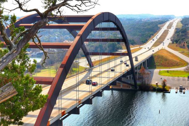 istock Dramatic Tree grows out over Town Lake at Pennybacker Bridge or 360 Bridge an Austin Texas Landmark 1141570262