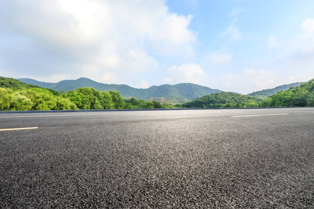 istock Asphalt road and mountains with blue sky on a sunny day 1141570341