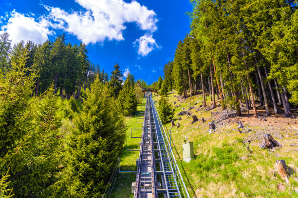 istock Funicular road in alps forest, Davos, Graubuenden, Switzerland. 1141572551