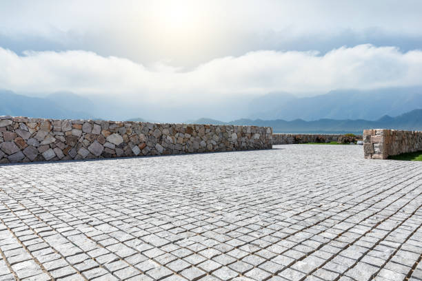 Rough square stone floor and mountain with sky landscape