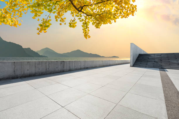 istock Empty floors and river with yellow ginkgo tree background 1141573922